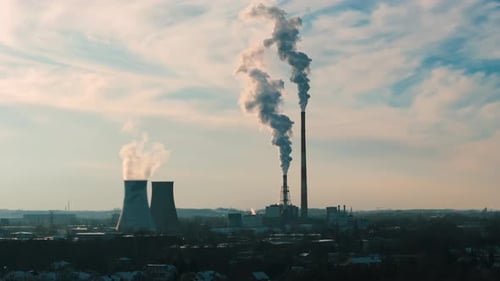 Smokestacks Releasing Pollution into the City Skyline