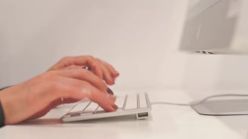 Close up of Woman Hands Typing on Computer Keyboard