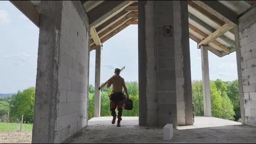 Man Standing in Under-Construction Building
