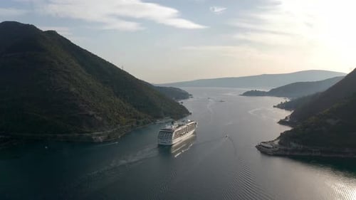Large cruise ship passing through the picturesque bay of Kotor in Montenegro