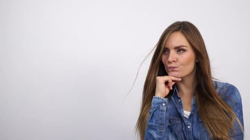 Woman Thinking Pointing at Copyspace