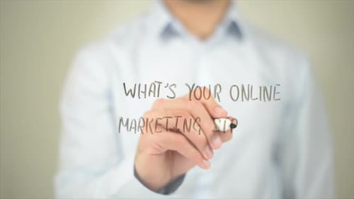 Man Writes 'Online Marketing Strategy' on Glass