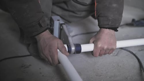 Man Connecting Pipes