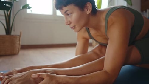Woman Stretching at Home for Health and Fitness