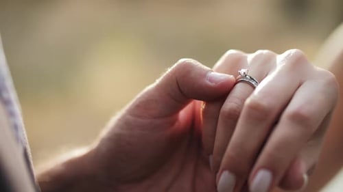 Closeup of Hands with Engagement Ring