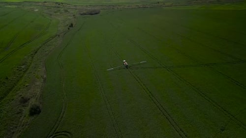 Spray Fertilize On Field With Chemicals In Agriculture Field