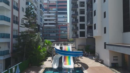 Aerial View Gorgeous Complex With Azure Pool and Water Slides for Kids By the Mediterranean Sea