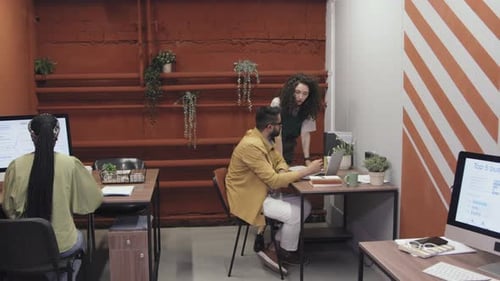 Diverse Team Members Working in Shared Office