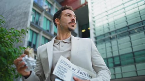 Leader Person Eating Lunch on Go Architecture Place Closeup Latin Man Hurrying
