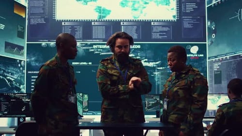 People in Uniforms Discussing Strategy in Command Center