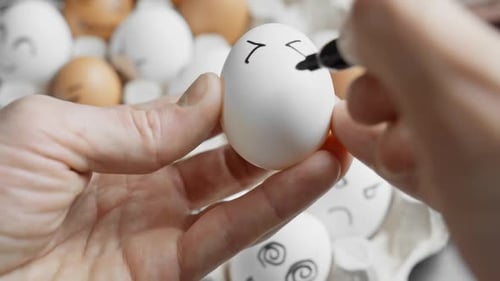 Drawing Cartoon Faces on Easter Eggs