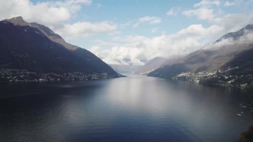 Aerial video over the famous Lake Como in Italy in a snowy winter.
