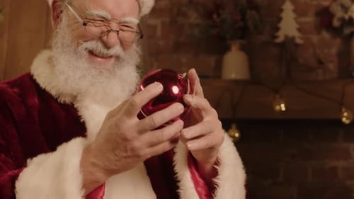 Santa Claus Decorating Christmas Tree with Ornament