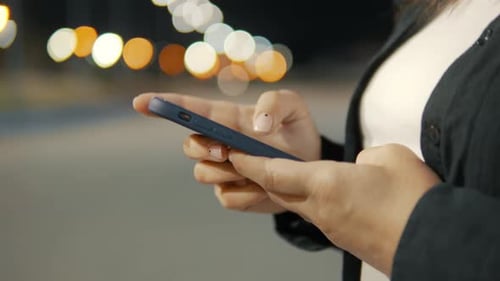 Close Up of an Young Woman Hands are Using a Smartphone Phone for Send Messages