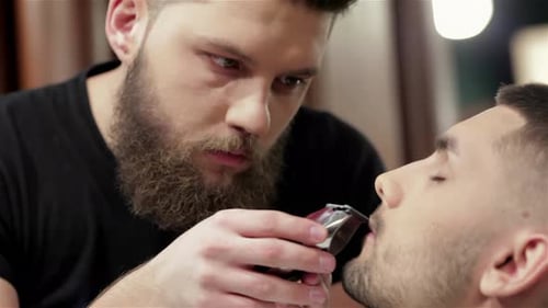 Man Getting Beard Trimmed by Barber Close-Up
