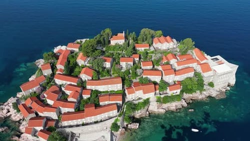 The Adriatic Sea and a beautiful aerial view of the coast and the island of Sveti Stefan.