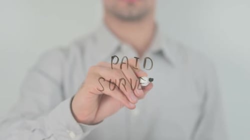 Man Writing Paid Survey With Black Marker
