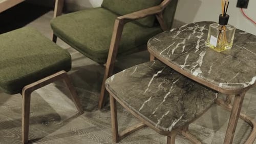 Stylish and Elegant Green Upholstered Chairs Are Paired with Beautiful Marble Accent Tables