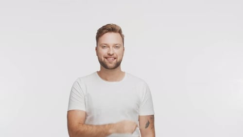 Expressive Young Man Over Vibrant Background Studio Portrait of Handsome Person