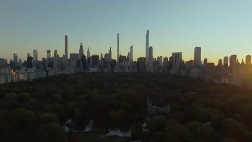 Warm Sunlight Illuminating Central Park and Midtown Manhattan Skyline During Sunset Creates a