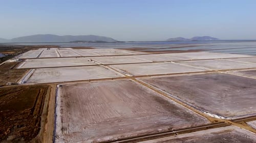 View of a Salt Flat Factory Besides the Sea Drone Shot of Salt Extraction