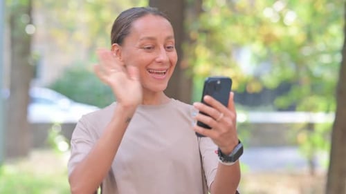 Woman Chatting on a Phone Video Call