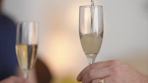 Close up of champagne being poured into a flute