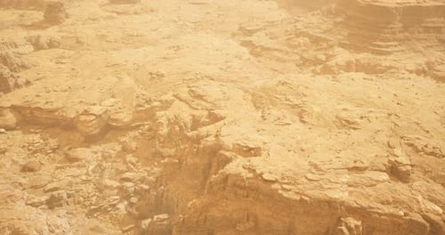 Exploration of an Arid Landscape with Rocky Terrain and Sandy Surfaces