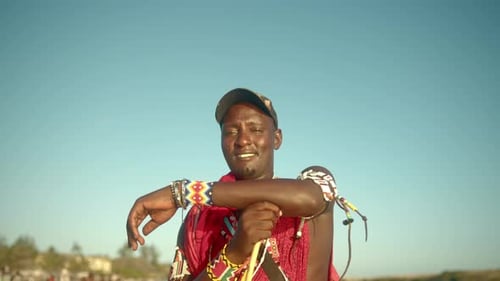 Aborigine African Maasai Warrior Man Wearing Traditional Dress And Jewelry In Kenya. Close Up
