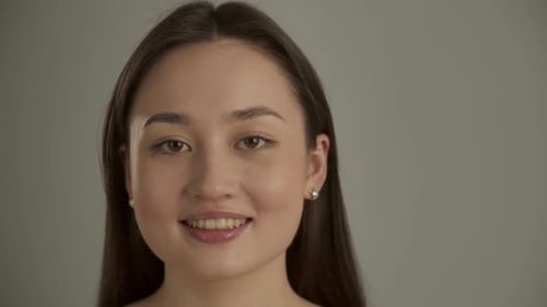 Smiling Young Adult Woman Portrait in Studio Setting