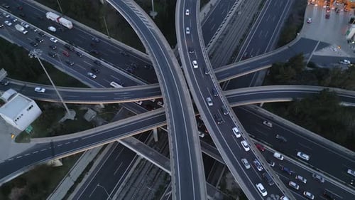 Cinematic Orbit Aerial Drone Shot of Highway Interchange with Traffic Flow at Evening
