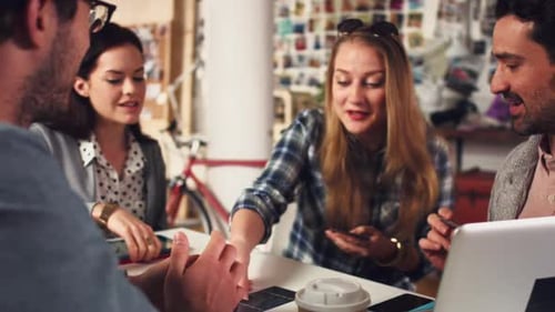 4k video footage of a group of designers working together in an office