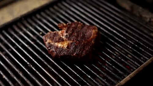 Delicious Steak Cooking on Grill