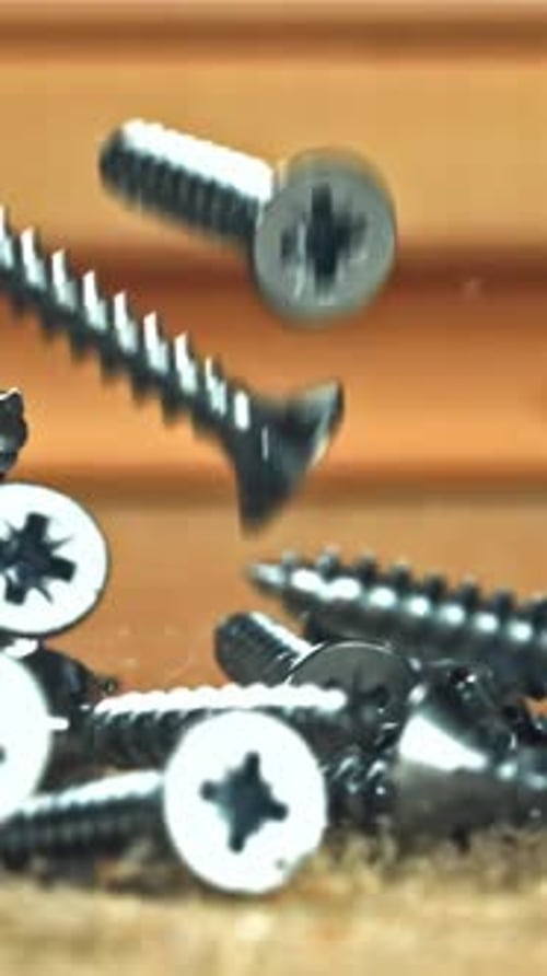 Selftapping Screws Fall on a Wooden Surface Filmed on a Highspeed Camera at 1000 Fps