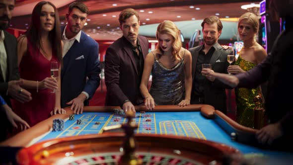 Group of Multiethnic Young Men and Women Entertaining Themselves with a ...