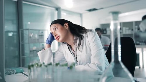 Woman Scientist Working in Bright Modern Laboratory