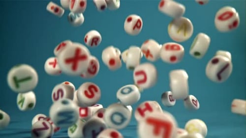 Alphabet Lettered Dice Falling Down on Blue Background