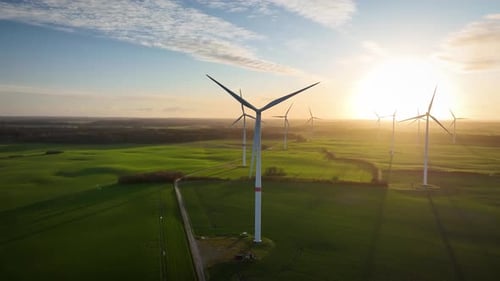 Slow camera movements around wind turbine and landscape.