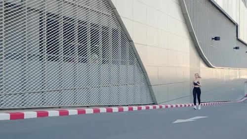 Young Woman Athlete Enjoys Yoga Sport Lifestyle Exercising Outdoors City Running Urban Street