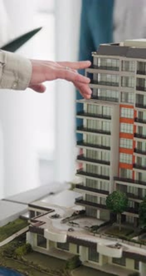Meeting, hands or building with 3D model for real estate development or planning renovation