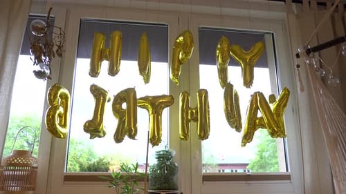 Shiny Gold Balloons Spell Happy Birthday