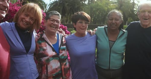 Happy Seniors Smiling Together in a Green Park