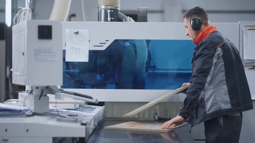 Automized Woodworking in Modern Furniture Factory Engineer of CNC Router is Changing Wooden Details