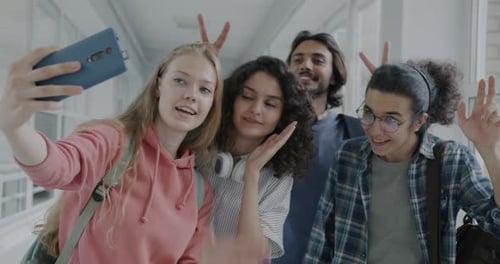 Slow Motion of Cheerful Men and Women Taking Selfie Enjoying Break in University Having Fun Together