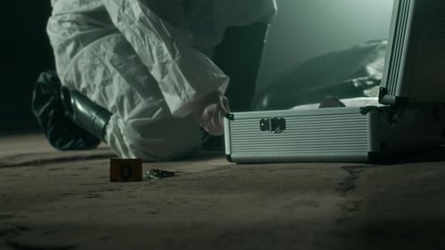 Forensic Scientist Investigating Crime Scene at Night