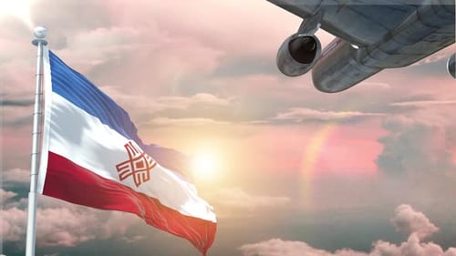 Waving Flag and Airplane Flying Over Sunset Sky