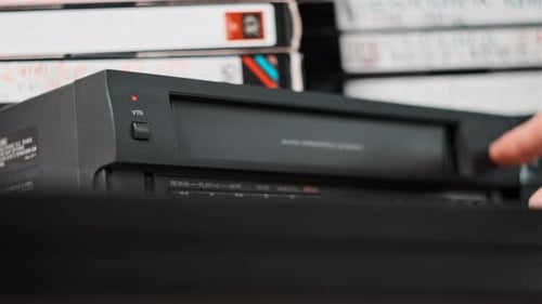 Inserting and Removing VHS Tape From VCR