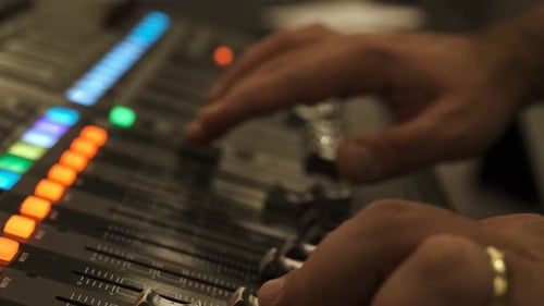 Working on a large sound mixer