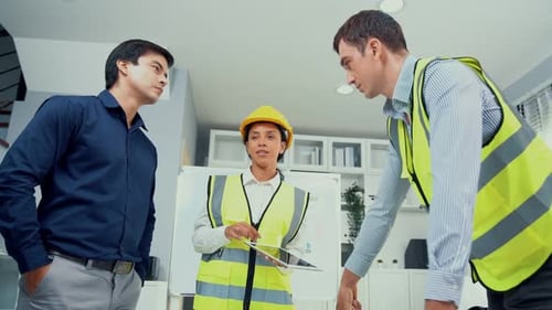 Colleagues Discuss Plans in Office Space