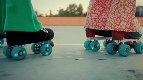 Stylish Friends Roller Skating Together on Rooftop